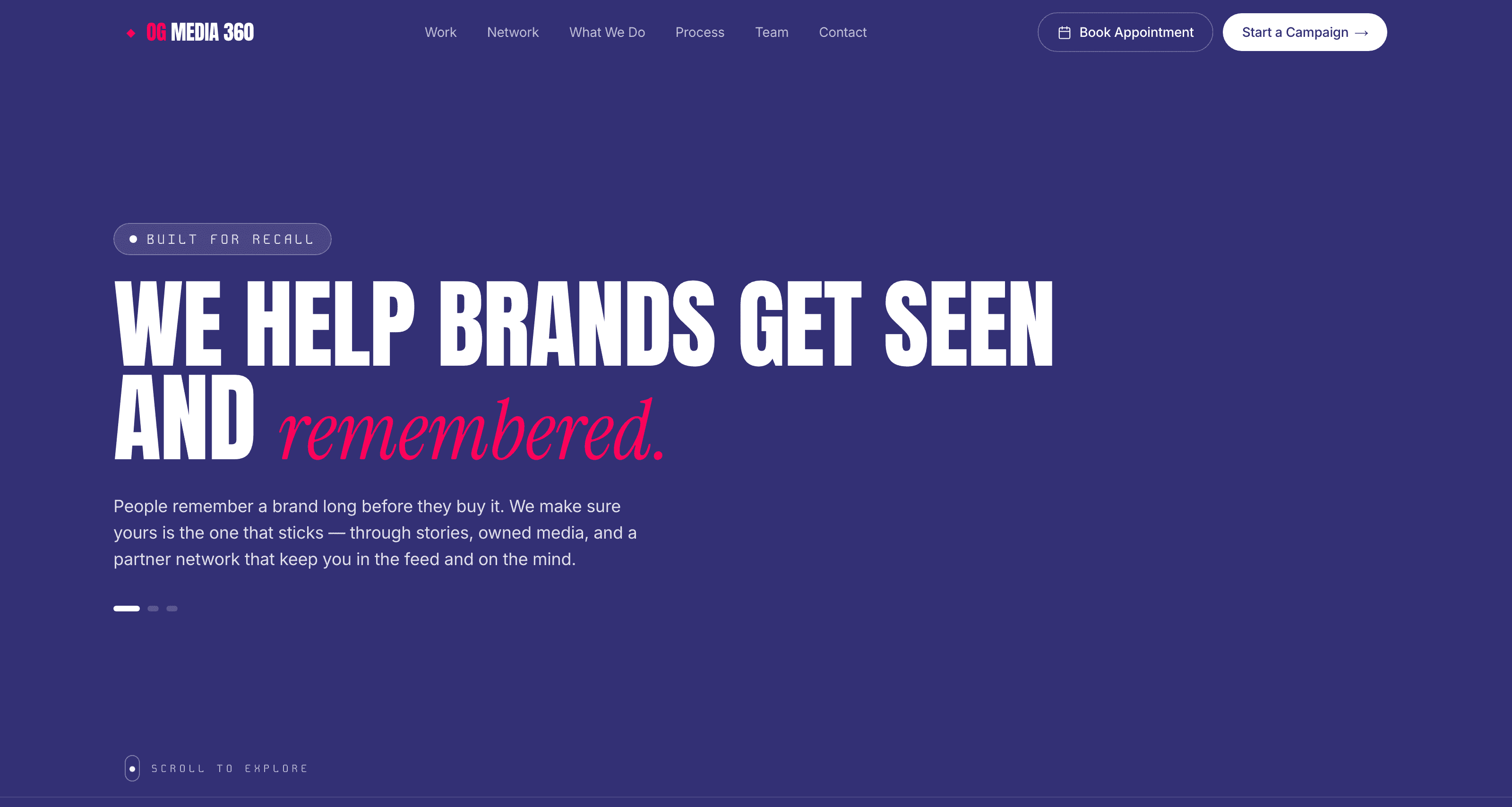 The OG Media 360 home page: the wordmark and navigation over a deep indigo ground, the headline “We help brands get seen and remembered” with the last word in pink italics, and a short standfirst beneath it.